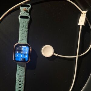 Apple Smartwatch with Teal Band and Gold Case
